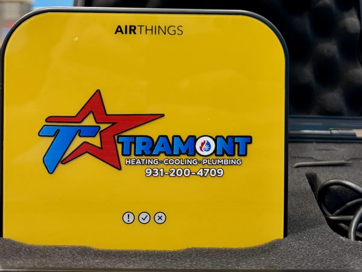 Tramont-labelled Airthings radon monitor in its carrying case