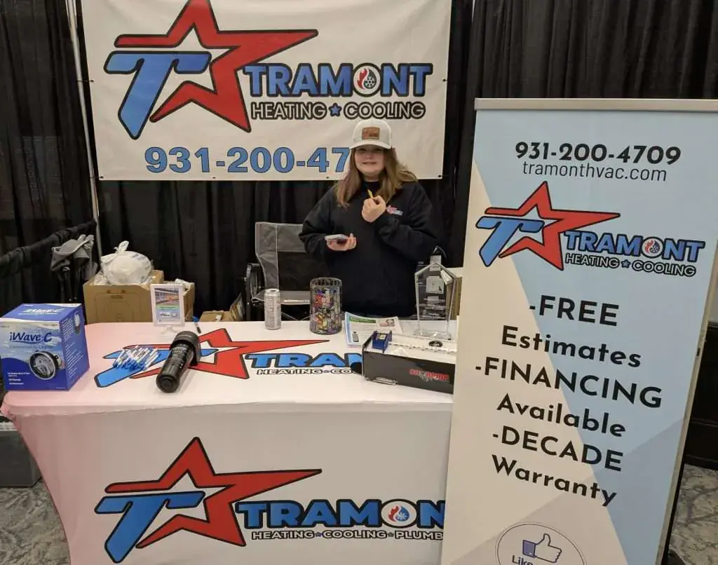 Tramont Heating Cooling Plumbing booth displaying free estimates