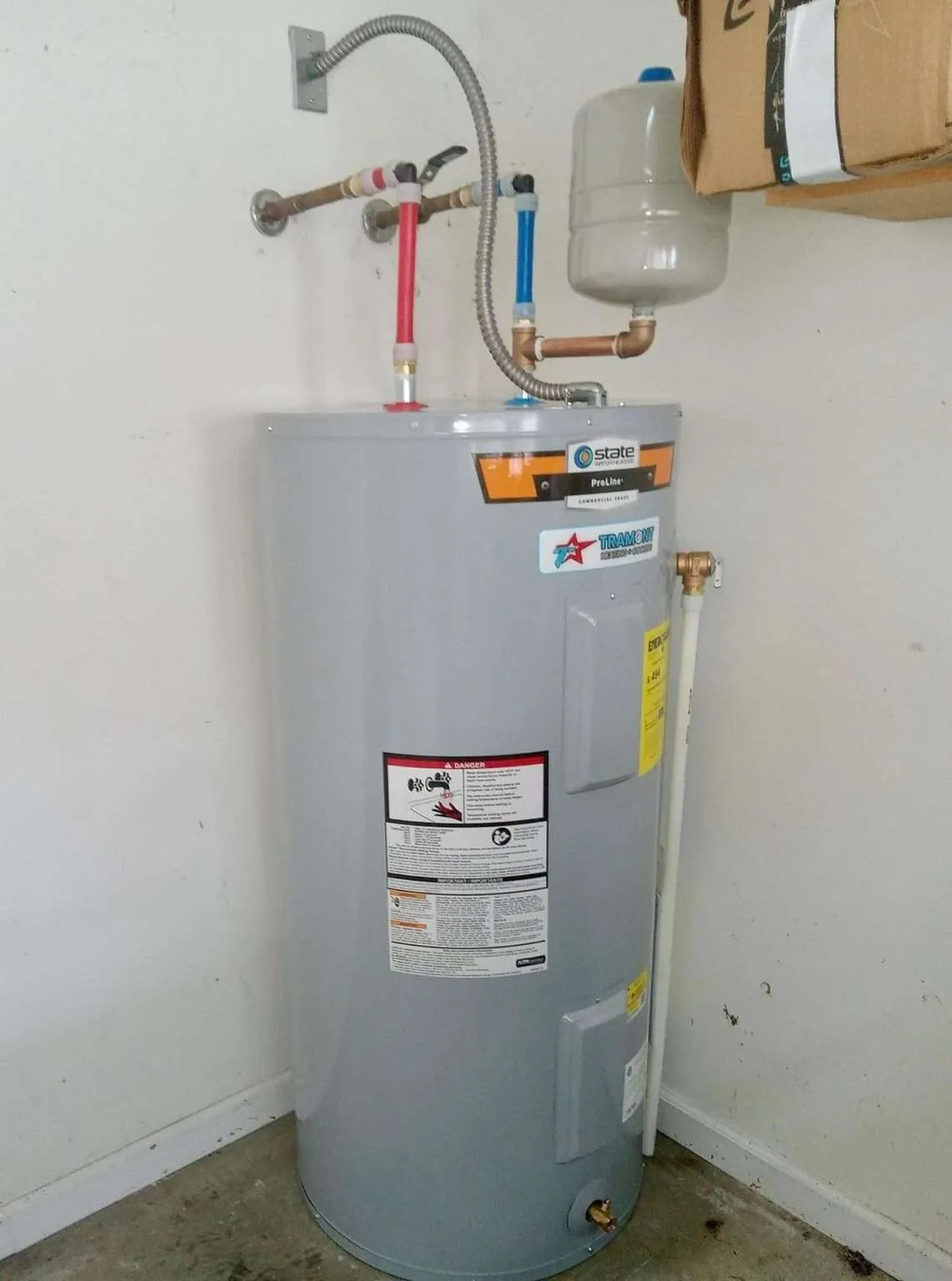 Water heater tank in a utility space