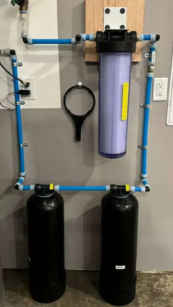 Whole-home water filter system on a wall